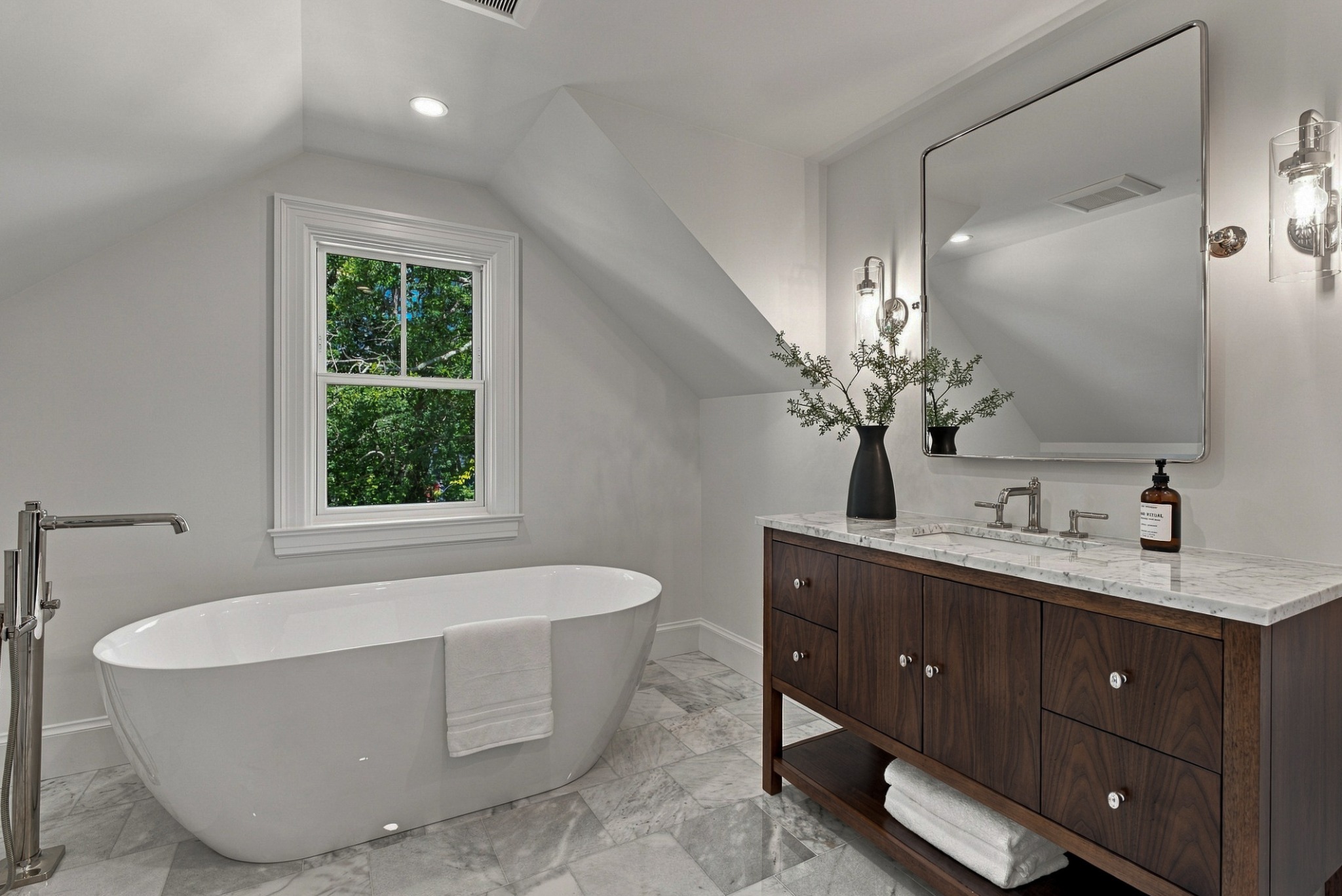 Oversized soaking tub in primary bathroom