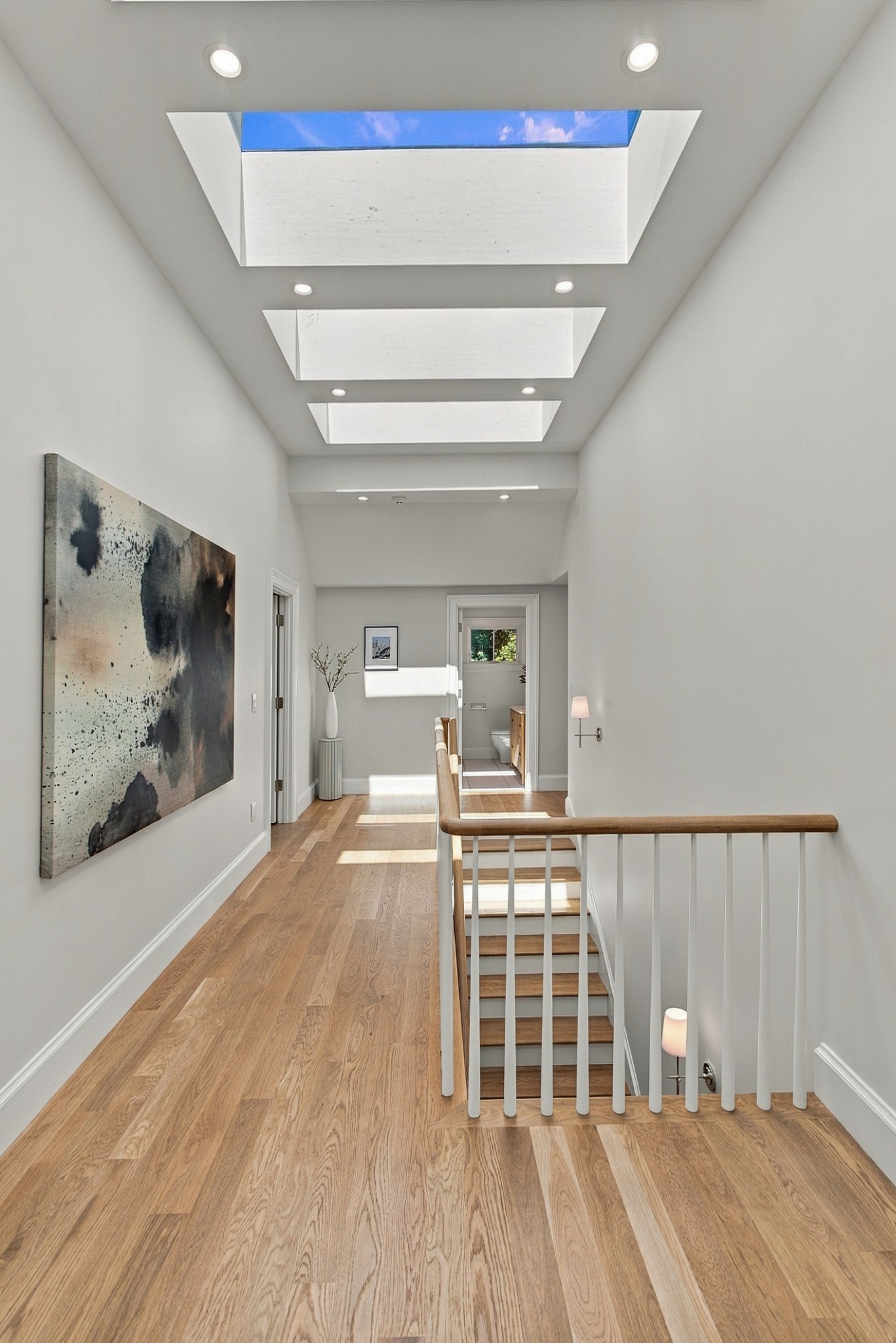 Skylit central stair hall